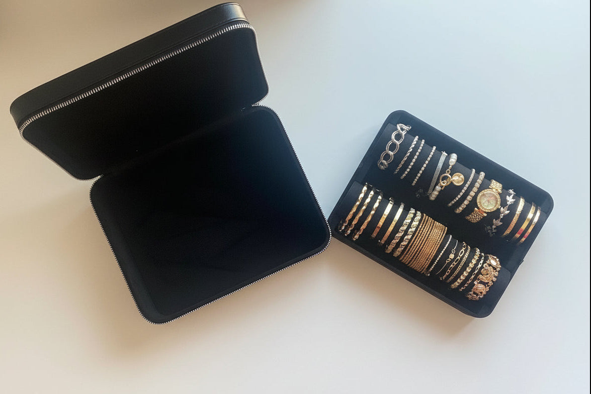 Black jewelry case and a bracelet holder, containing bracelets, side by side on a white background